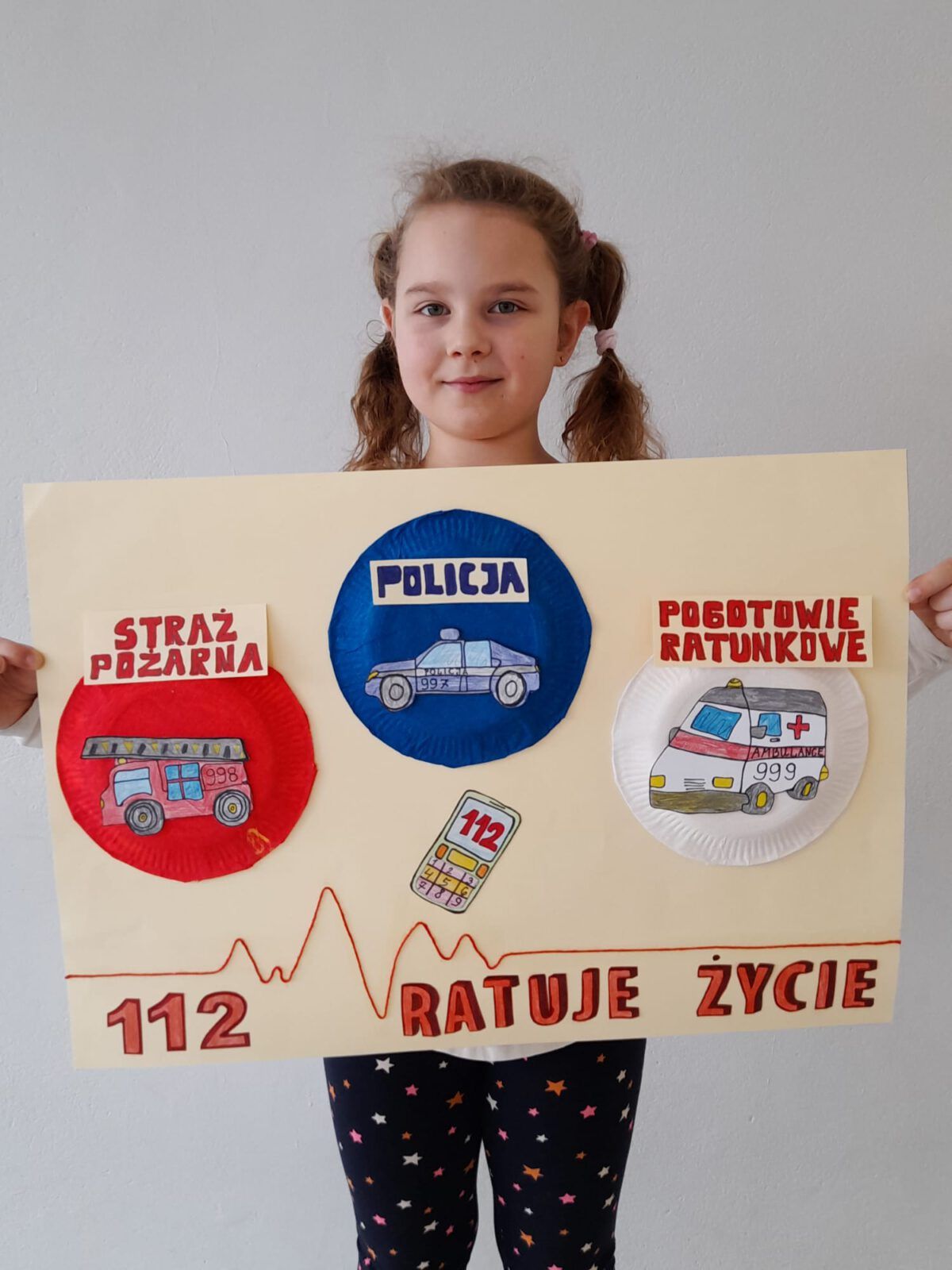 Dziewczynka z plakatem - zwyciężczyni w konkursie