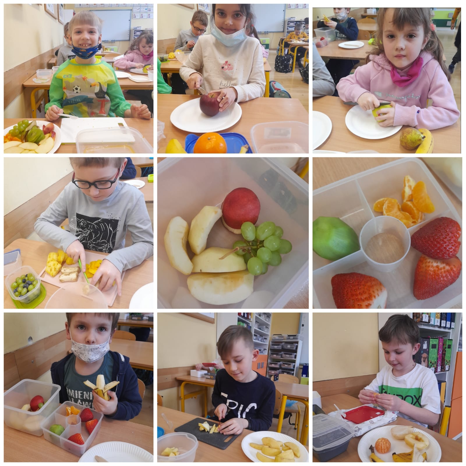 dzieci pokazują swoje śniadaniówki wypełnione owocami