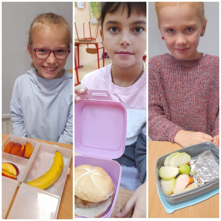 Uczniowie pokazują swoje zdrowe śniadania, owoce, warzywa i pieczywo