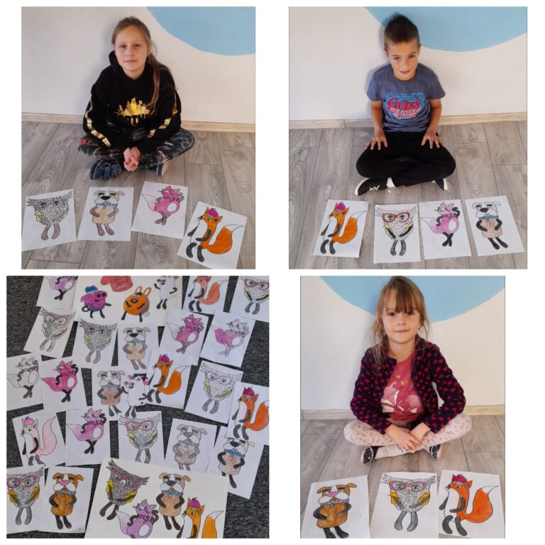 dzieci pokazują swoje prace: pokolorowane zwierzęta: lista, sowę i świnkę