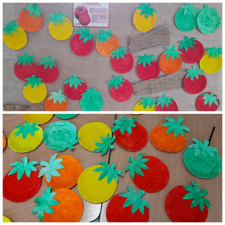 kolorowe pomidory żółte, czerwone i pomidorowe wykonane z papieru przez uczniów