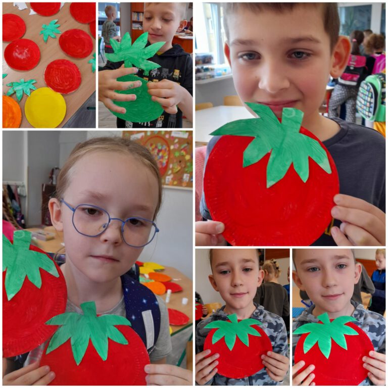uczniowie demonstrują kolorowe pomidory wykonane z papieru