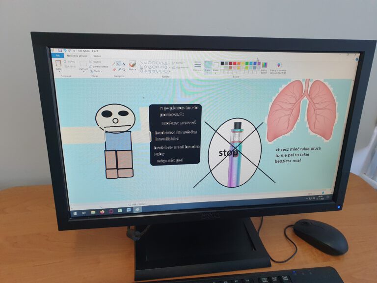 ekran monitora komputerowego z grafiką ucznia na temat szkodliwości palenia