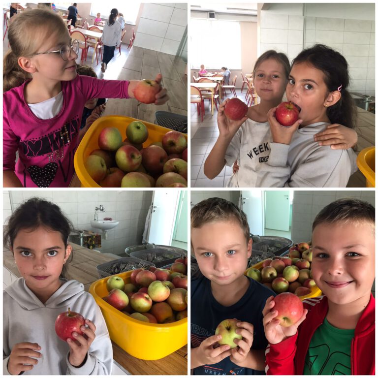 uczniowie jedzą jabłka