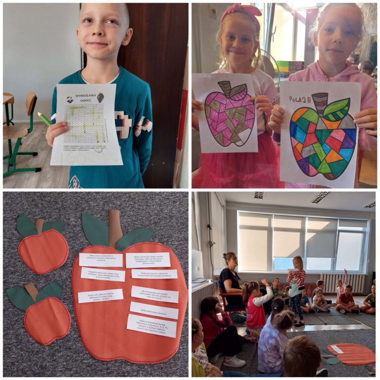 uczniowie pokazują swoje prace plastyczne związane z jabłkami
