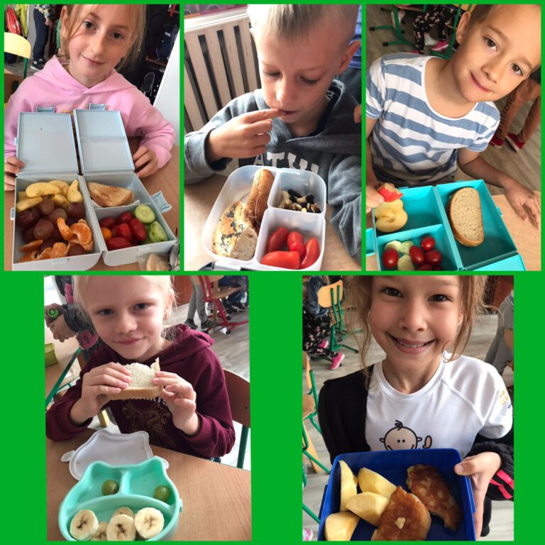chłopcy i dziewczynki pokazują śniadaniówki ze zdrową żywnością ,ciemnym pieczywem, warzywami i owocami