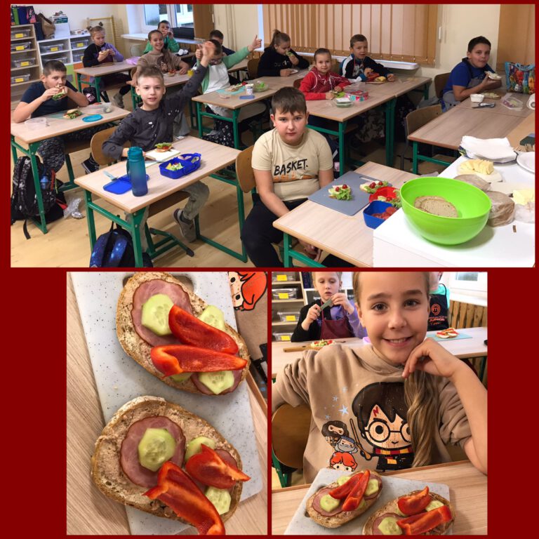 uśmiechnięci uczniowie siedzą w ławkach szkolnych i pokazuj swoje śniadaniówki - posiłki z chleba, warzyw i owoców