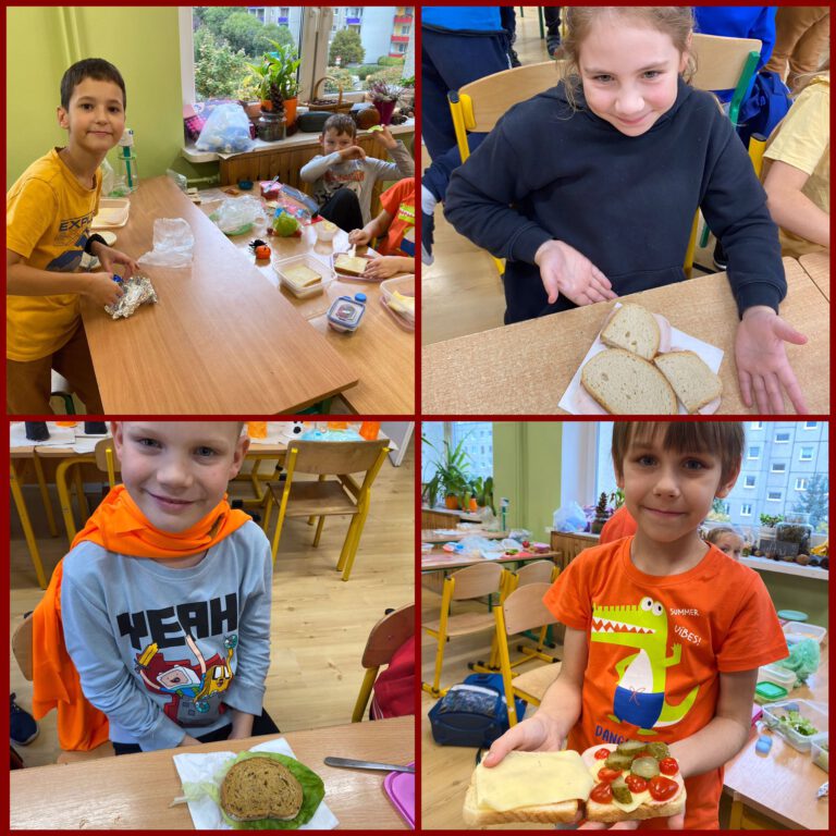dzieci pokazują swoje zdrowe kanapki wykonane z chleba, warzyw i owoców